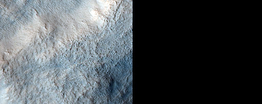 Dipping Layers on Old Crater Rim in Deuteronilus Mensae