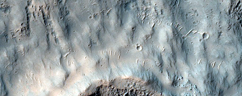 Crater Within Ejecta East of Reull Vallis