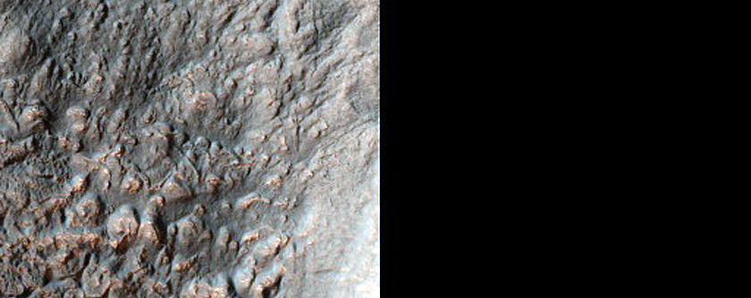 Concentric Crater Fill in Thaumasia Fossae