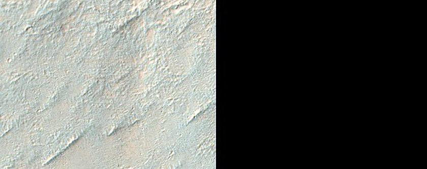 Possible Bedrock Exposure in Small Crater South of Nirgal Vallis