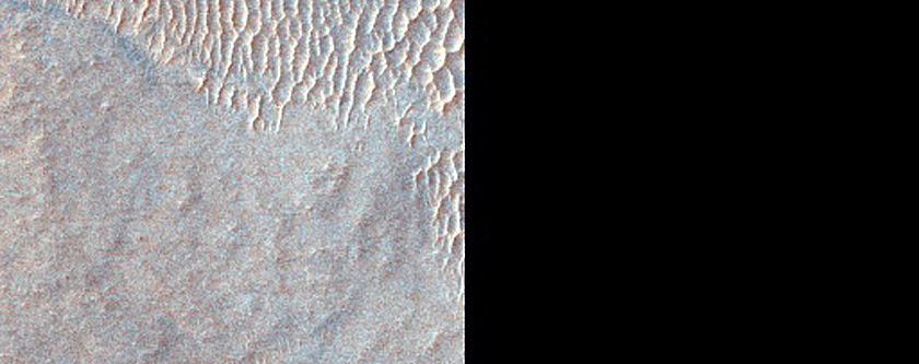 Possibly Olivine-Rich Materials on Hellas Planitia Floor