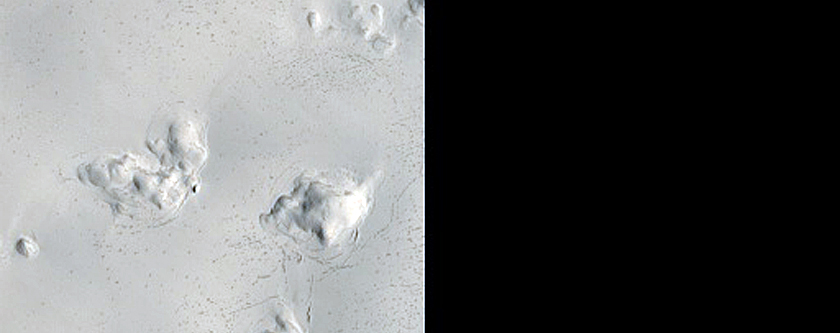 Cracks and Hollows in Crater in Arabia Terra