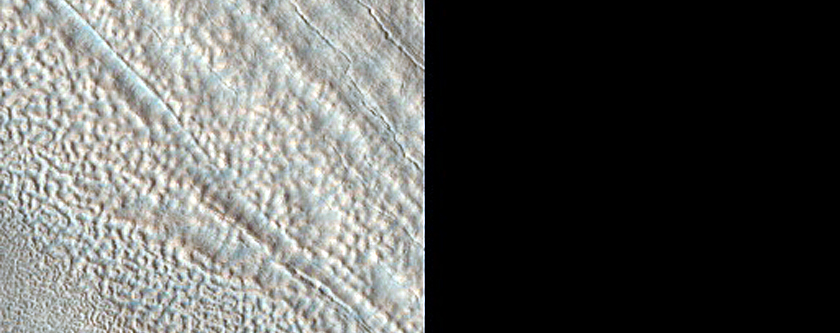 Layered Deposits within Impact Crater in Utopia Planitia 