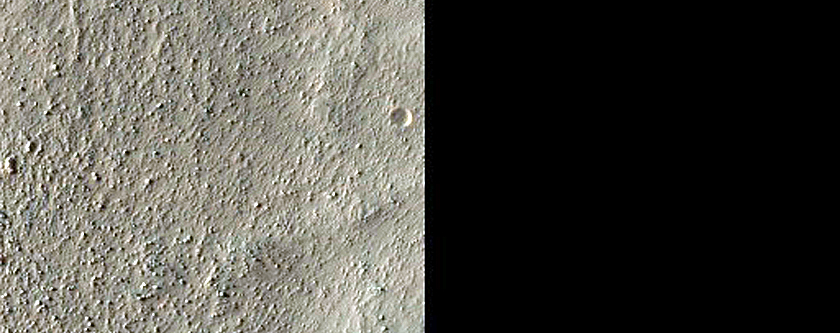 Possibly Olivine-Rich Materials in Northwestern Hellas Basin