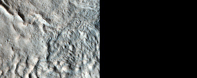 Dipping Layers in Craters near Mamers Valles