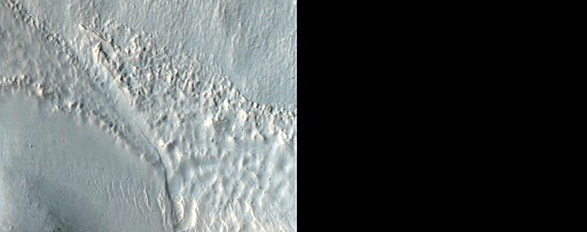 Possible Olivine-Bearing Materials at Edge of Crater near Newton Crater