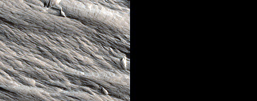 Possible Scour Pits adjacent to Yardangs in Southwest Olympus Mons