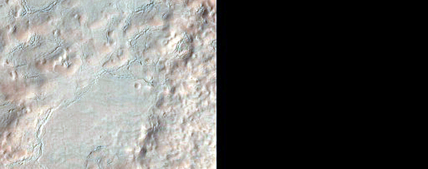 Ridges and Fractures in Sublimation-Pit Crater with Hale Crater Ejecta