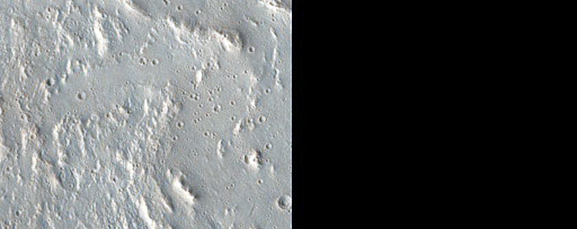 Complex Crater near Streamlined Feature in Bahram Vallis