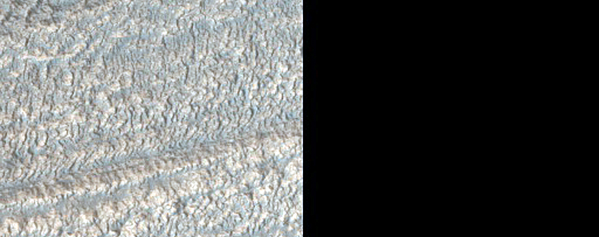 Channel Feature Into Degraded Crater in Deuteronilus Mensae