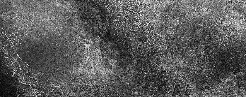 Spot Development Influenced by Underlying Terrain in Crater