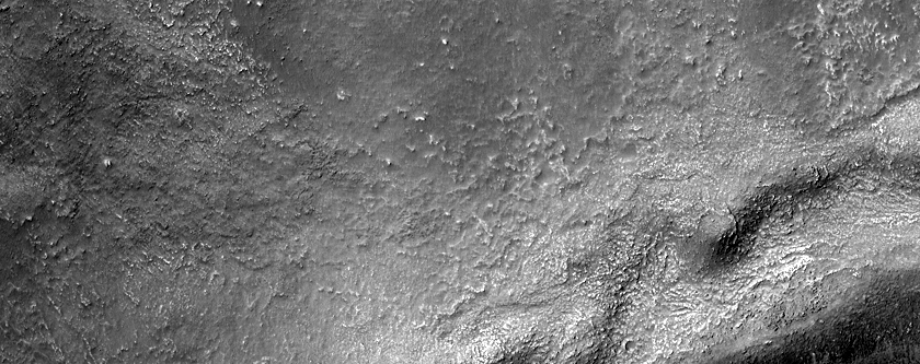 Features in Small Crater in Aonia Terra