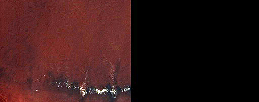 Mesa Edge with Small Gullies Seen in MOC Image E11-03109 near Sisyphi Cavi