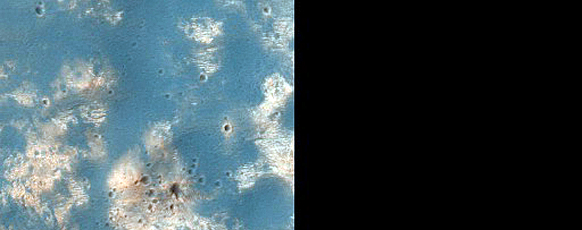 Phyllosilicate-Rich Terrain Exposed by Crater North of Hellas Planitia