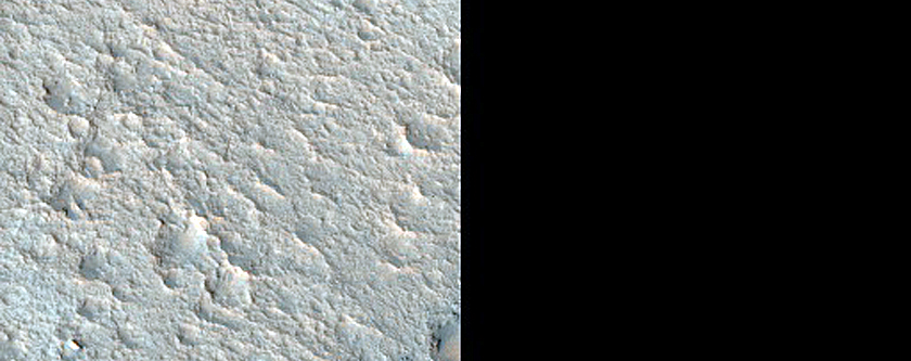 Layered Deposits in Small Craters on Floor of Zulanka Crater