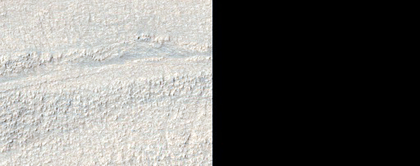 Crater and Banded Terrain in Hellas Planitia