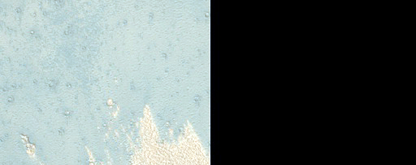 Monitoring Crater with Dark Rays and Light-Toned Distal Ejecta Facies