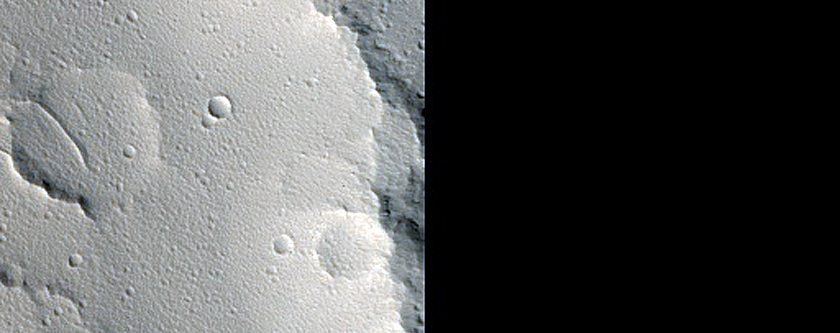 Elliptical Crater with Butterfly-Shaped Ejecta near Uranius Dorsum