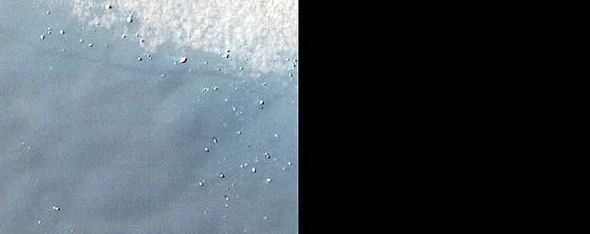 Bright Icy Patch on Dune Field in Terra Sirenum