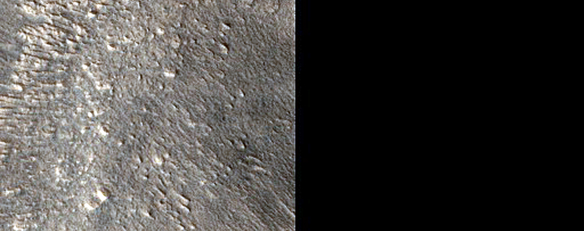 Dipping Layered Feature along Valley in Arabia Terra