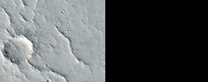Rays of Small Dark Crater in North Tharsis Region