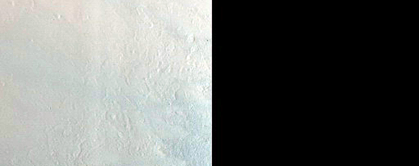 Impact Crater Exposing Bedrock