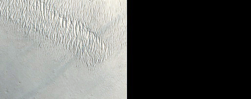 Crater Adjacent to Channel in Naktong Vallis