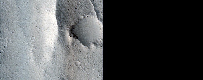 Candidate Recent Impact Site in Sacra Sulci