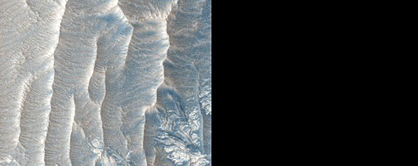Interaction between Layer Types on East Rim of Crater