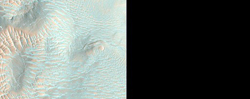 Possible Clay Deposit Exposed in Crater Rims South of Nirgal Vallis