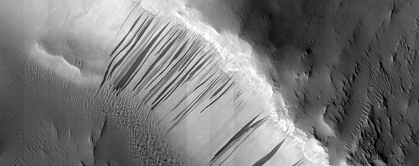 Possible Pyroxene-Rich Material on Arabia Terra Crater Wall