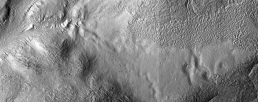 Gullies and Flow Features along Crater Wall in Promethei Terra