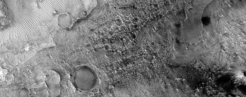 Scattered Dunes in Channel Northeast of Syrtis Major Planum