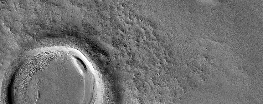 Layered Features in Craters in Nilosyrtis Mensae