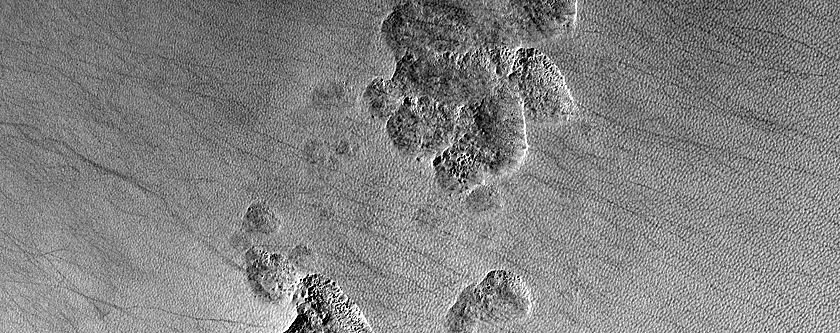 Pits in Mantle Deposit