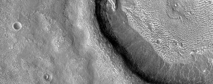 Dipping Layers in Crater in Northern Mid-Latitudes