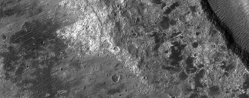 Clay-Rich Terrain Associated with Fresh Crater Ejecta on Ladon Valles Floor
