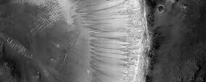 Layered Stratigraphy Exposed in Crater Wall