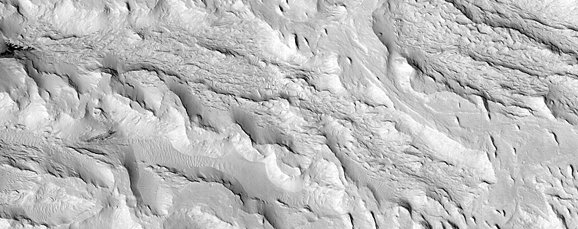 Transition from Fluvial Ridges to Flat-Lying Rock at Aeolis Dorsa