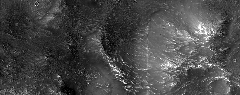 Proximal Mpact Related Deposits and Flows Northeast of Hellas Planitia