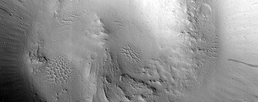 Modified Central Uplift of Crater in Tharsis Region