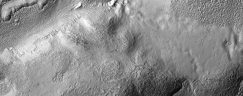 Gullies and Flow Features along Crater Wall in Eastern Hellas Region
