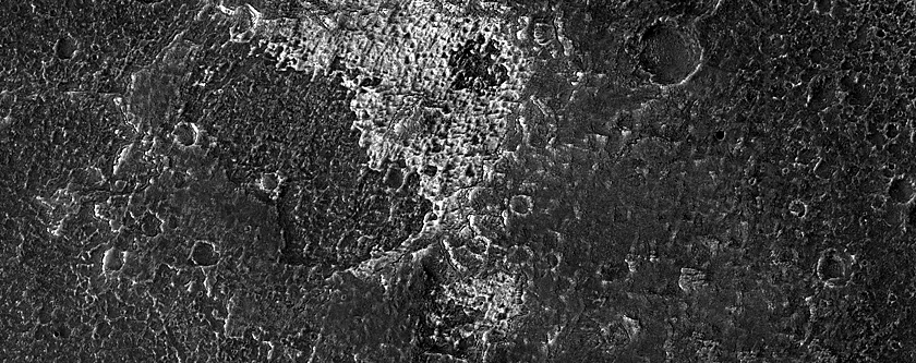 Light-Toned Deposit in Crater adjacent to Candor Chasma