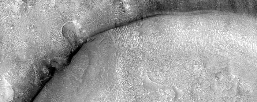 Dipping Layers in Crater in Deuteronilus Mensae