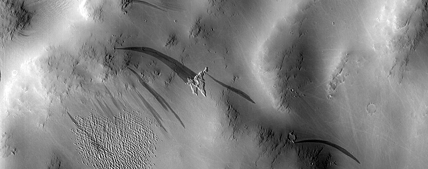Slope Streak and Pedestal Crater near Medusae Fossae