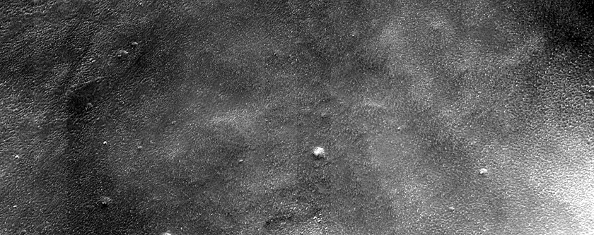 Crater Rim Intersecting Tantalus Fossae