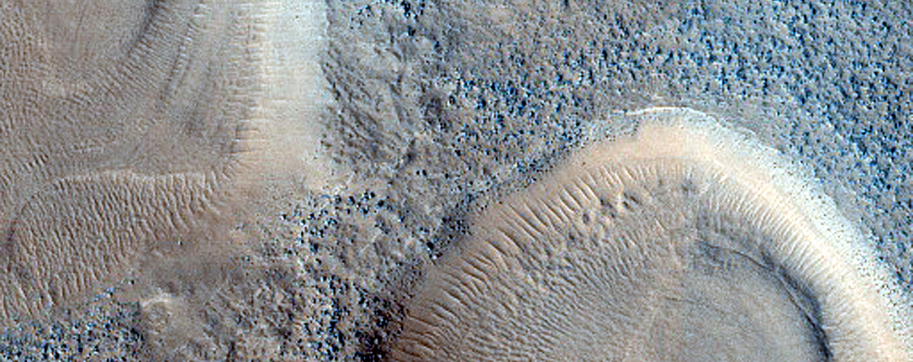 Layered Features in Craters in Northern Mid-Latitudes