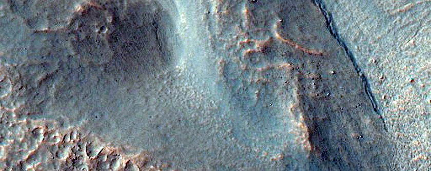 Crater with Tongue-Shaped Features on Walls