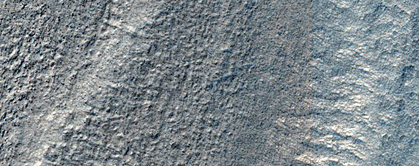 Dipping Layers Against Mounds in Hellas Planitia