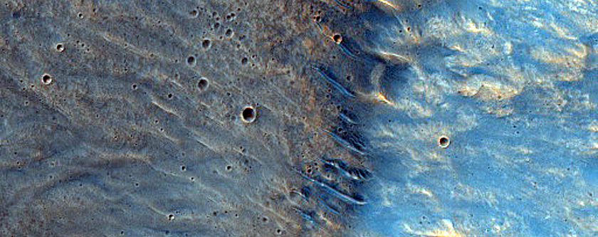 Impact Related Deposits and Flows near Hadriacus Mons